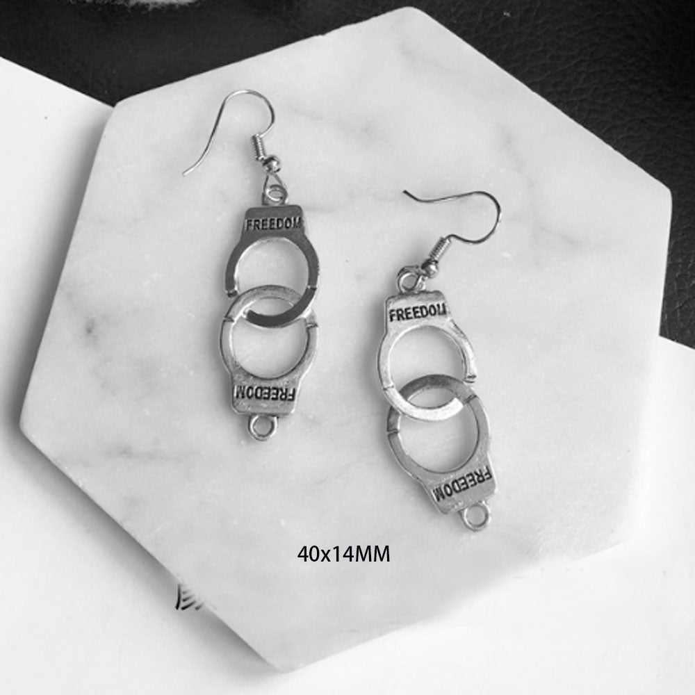 goth alloy ancient silver piercing gun handcuff money toothpaste dangle drop earrings jewelry